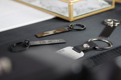 Keychains on a textured surface with a blurred background