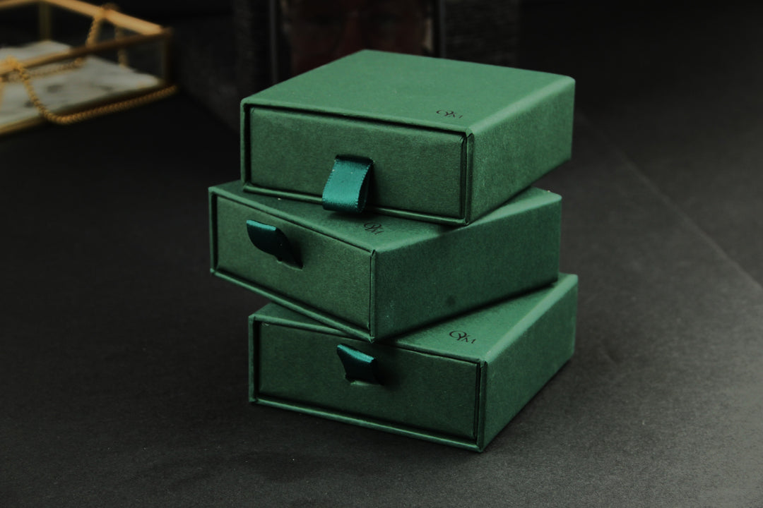 Green Packaging on a dark textured background