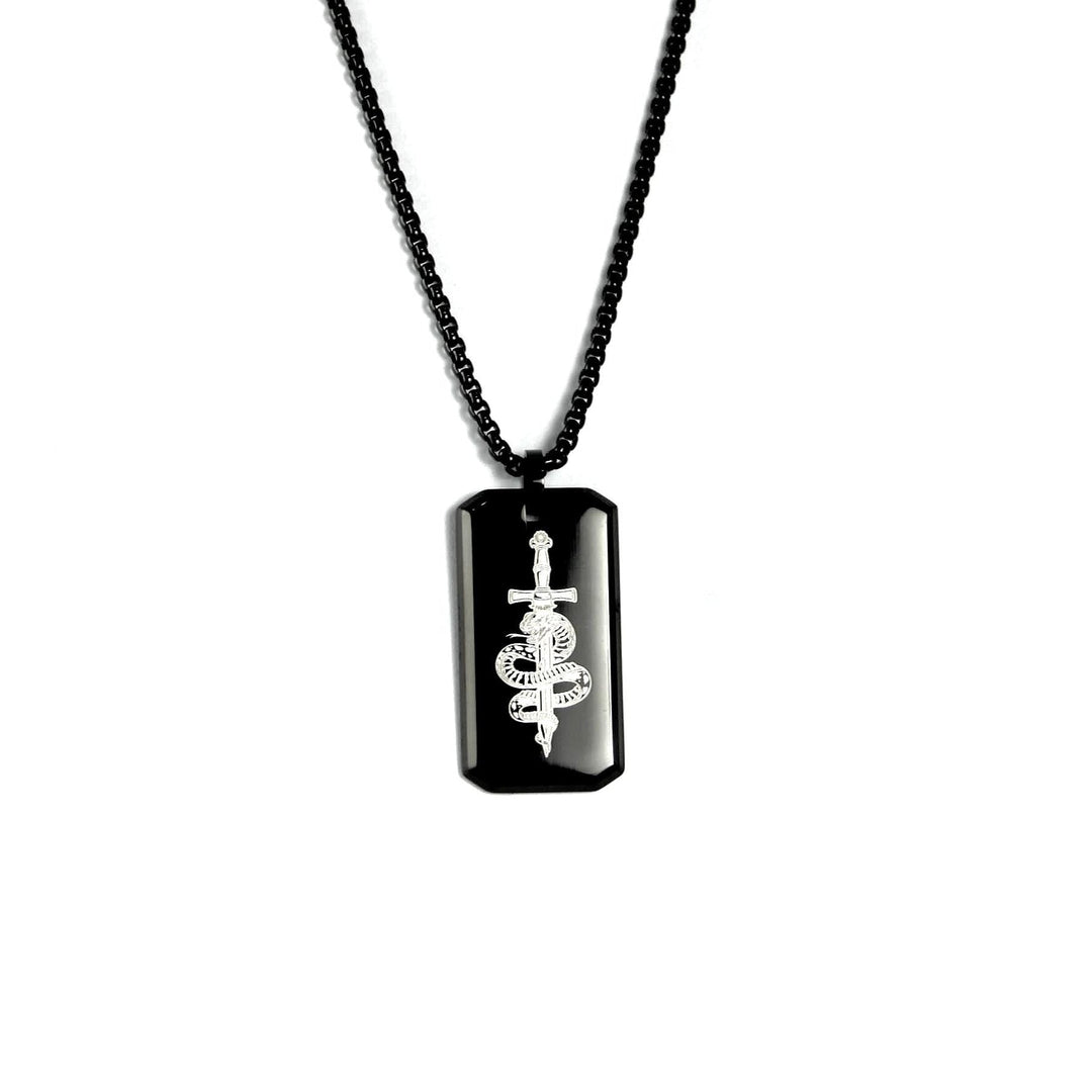 Black dog tag necklace with a white symbol on a white background