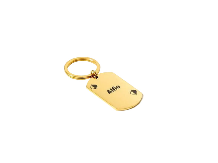 Gold keychain with a tag displaying 'Alfie' on a white background