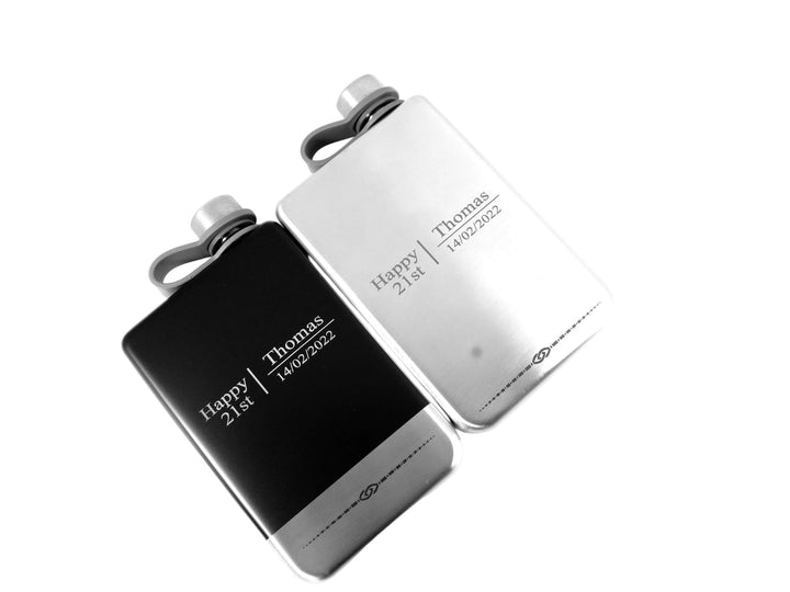Personalized black and white leather wallet with engraved text on a white background