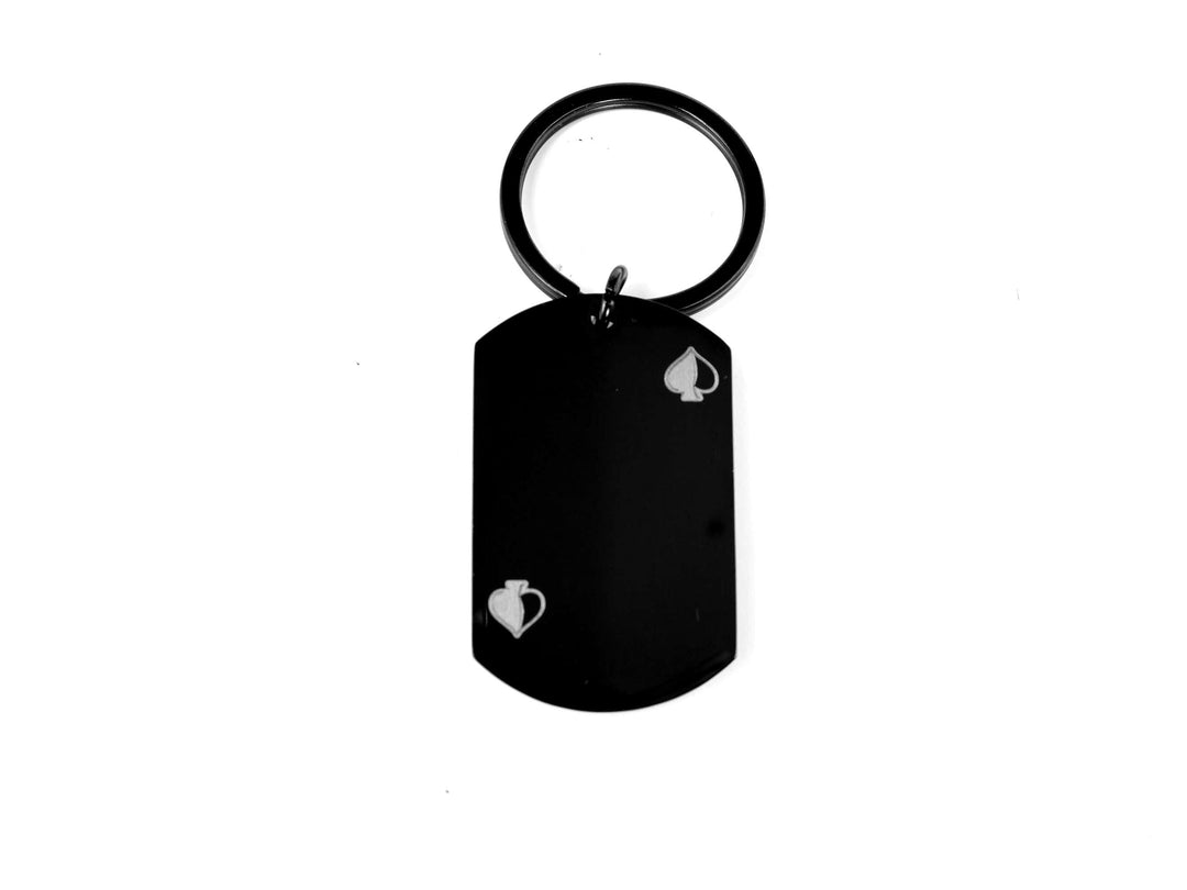 Black keychain with a heart design on a white background
